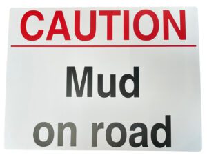 MUD ON ROAD SIGN
